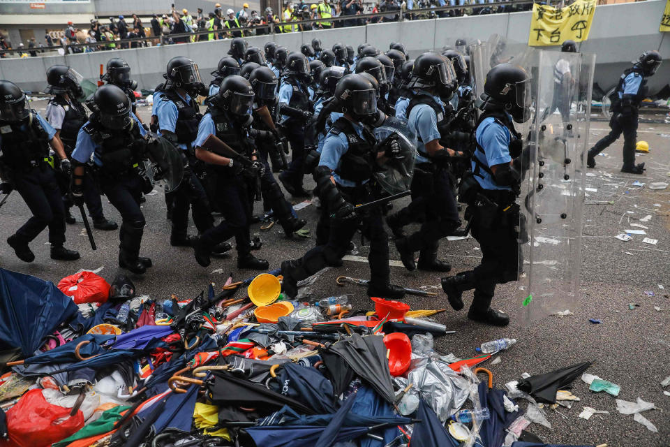 Police advance towards protesters during a rally against a controversial extradition law proposal outside the government headquarters in Hong Kong on June 12. | Dale De La Rey—AFP/Getty Images