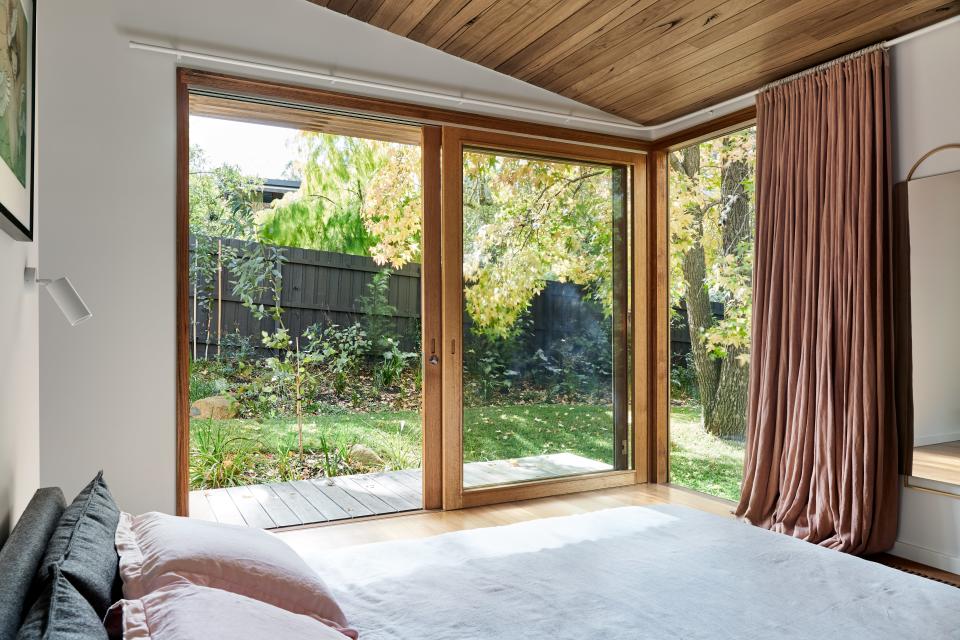 The sliding doors provide light and warmth in the bedroom