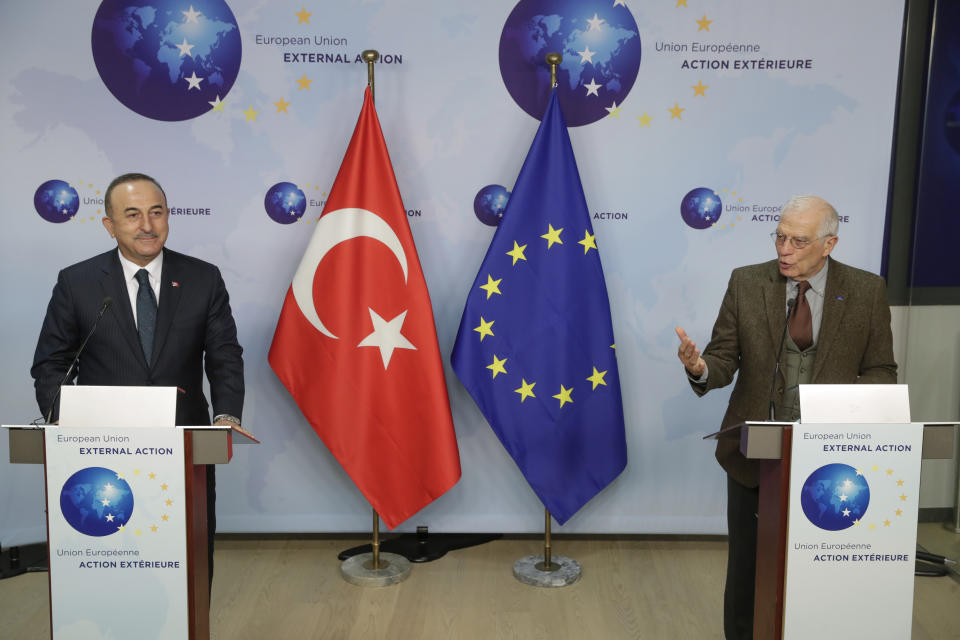 Turkey's Foreign Minister Mevlut Cavusoglu, left, and European Union foreign policy chief Josep Borrell give a joint statement prior to their meeting in Brussels, Thursday, Jan. 21, 2021. (Stephanie Lecocq/Pool Photo via AP)