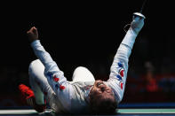 LONDON, ENGLAND - JULY 31: Byungchul Choi of Korea celebrates winning his match against Jianfei Ma of China during the quaterfinals of the Men's Foil Individual on Day 4 of the London 2012 Olympic Games at ExCeL on July 31, 2012 in London, England. (Photo by Hannah Johnston/Getty Images)