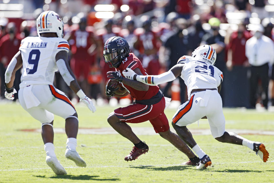 COLUMBIA, SC - OCTOBER 17: Shi Smith #13 of the South Carolina Gamecocks looks for running room after catching a pass against Smoke Monday #21 of the Auburn Tigers in the second quarter of the game at Williams-Brice Stadium on October 17, 2020 in Columbia, South Carolina. (Photo by Joe Robbins/Getty Images)