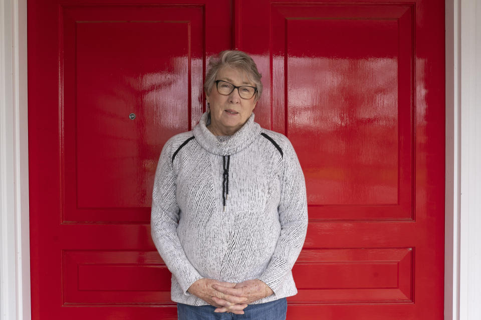 Joyce Ares stands for a portrait in front of her home on Friday, March 18, 2022, in Canby, Ore. She had volunteered to take a blood test that is being billed as a new frontier in cancer screening for healthy people. It looks for cancer by checking for DNA fragments shed by tumor cells. (AP Photo/Nathan Howard)