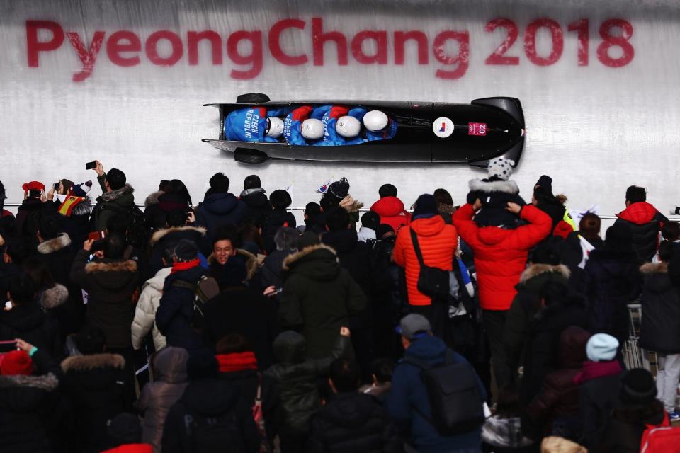 <p>Stuart Hannagan, VP of Editorial, Getty Images <br>Photo - Lars Baron <br>4-man Bobsleigh moves as fast as any winter sports possibly can. The Getty Images photographer Lars Baron has not only captured a terrific image of the aerodynamic wind resistant position of the athletes (heads down) but the large crowds who turned out each day to witness the events. Lars has framed the image in almost a three dimensional way with the crowd in the foreground, the bobsled in the middle and the PyeongChang sign appears in the third dimension.</p>