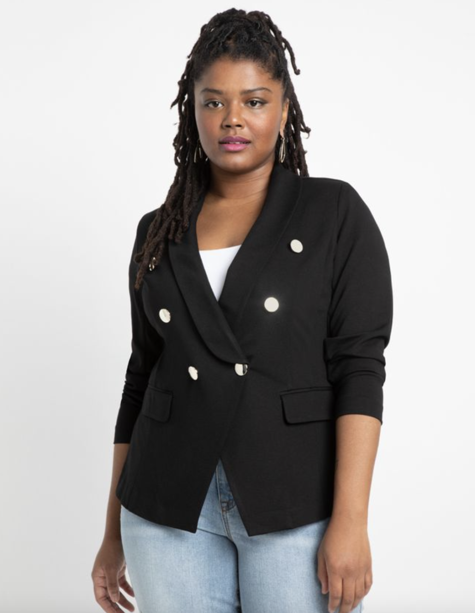 black model plus size in blue jeans and black Double Breasted Blazer (Photo via Eloquii)