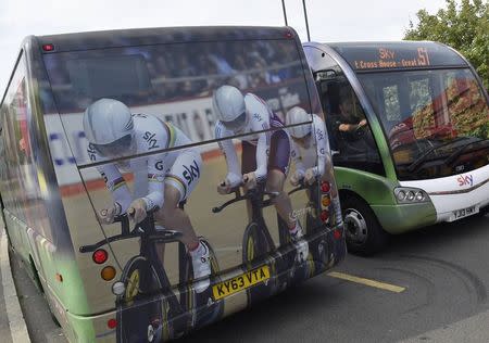 Two British Sky Broadcasting (BSkyB) employee minibuses pass each other in west London July 25, 2014. REUTERS/Toby Melville