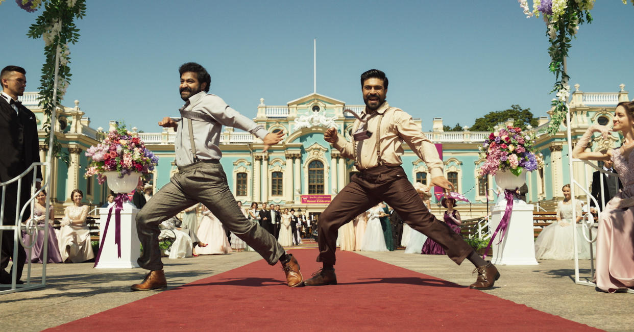 (L-R) N.T. Rama Rao Jr and Ram Charan perform the “Naatu Naatu” dance in ‘RRR’