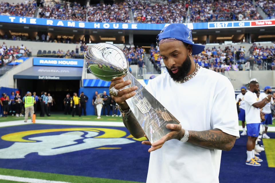 INGLEWOOD, CALIFORNIA - SEPTEMBER 08:  Odell Beckham Jr. holds the Super Bowl LVI trophy before the NFL game between the Los Angeles Rams and the Buffalo Bills at SoFi Stadium on September 08, 2022 in Inglewood, California. (Photo by Harry How/Getty Images)