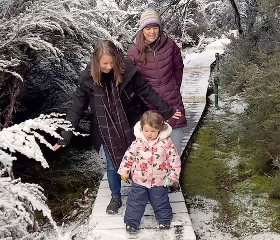 <p>Bindi Irwin/Instagram</p> Bindi Irwin, daughter Grace and mom Terri walk along a snowy path in Tasmania.