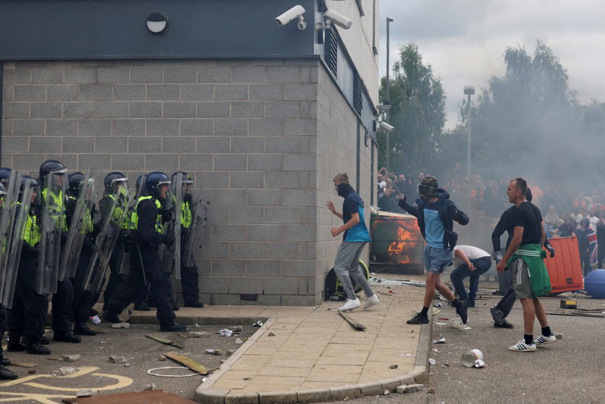 FILE PHOTO: Demonstrators clash with police officers during an anti-immigration protest, in Rotherham, Britain, August 4, 2024. REUTERS/Hollie Adams/File Photo