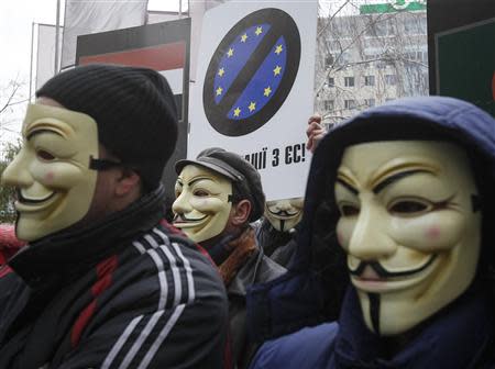 People take part in a symbolic funeral procession and an anti-EU rally near the EU Delegation building in Ukraine in Kiev November 28, 2013. REUTERS/Gleb Garanich