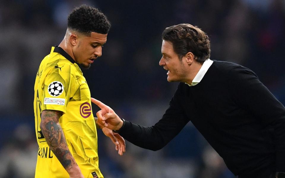 Borussia Dortmund's Jadon Sancho is addressed by Edin Terzic during the Champions League semi-final against Paris Saint-Germain