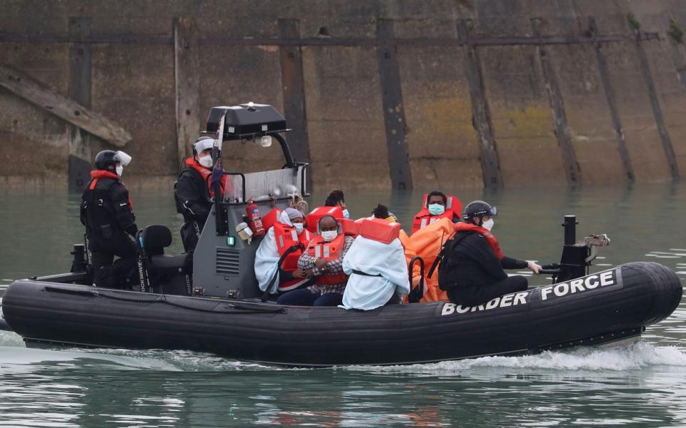 Migrants being brought ashore in Dover on Tuesday - PA