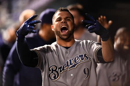 May 11, 2018; Denver, CO, USA; Milwaukee Brewers catcher Manny Pina (9) reacts to his game tying two run home run in the ninth inning against the Colorado Rockies at Coors Field. Mandatory Credit: Ron Chenoy-USA TODAY Sports