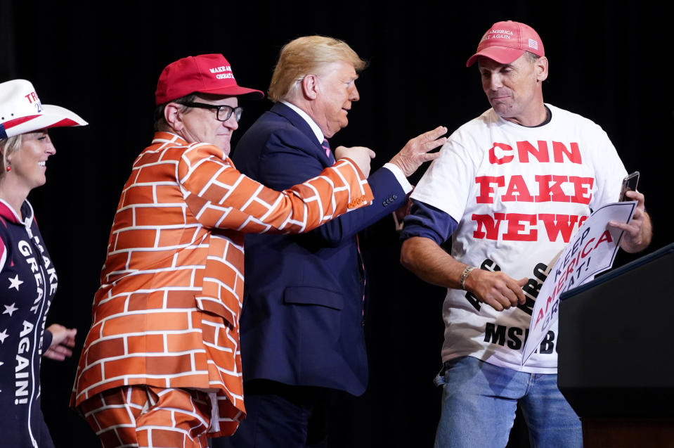 U.S. President Donald Trump talks with supporters that he called up on to the stage during a campaign rally at the Las Vegas Convention Center in Las Vegas, Nevada, U.S., February 21, 2020. REUTERS/Kevin Lamarque     TPX IMAGES OF THE DAY