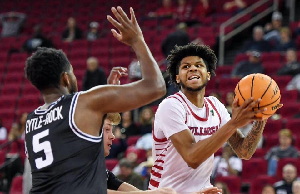 Fresno State’s Donavan Yap has trouble finding an outlet around Utah State’s RJ Eytle-Rock during their Mountain West Conference game at the Save Mart Center in Fresno on Saturday, Jan. 28, 2023.