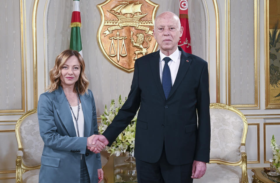 In this photo provided by the Tunisian Presidency, Tunisian President Kais Saied, right, shakes hands with Italian Prime Minister Giorgia Meloni, in Tunis, Wednesday April 17, 2024. Meloni and Saied signed new accords part of Italy's larger "Mattei Plan" for Africa, a continent-wide strategy aimed at growing economic opportunities and preventing migration from Africa to Europe.(Slim Abid/ Tunisian Presidential Palace via AP)