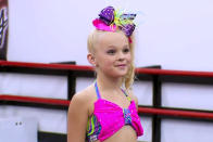 <p>Siwa followed up her debut with a two-season stint on <em>Dance Moms </em>in 2015.</p> <p>Siwa and her mom, Jessalyn, became staples on the show, with Jessalyn saying when the pair were introduced for season 2, "I would say it's my mission in life to make JoJo a star." For her part, Siwa was known for being unafraid to talk back to coach Abby Lee Miller. </p> <p>Siwa told <a href="https://people.com/celebrity/jojo-siwa-five-things-to-know-about-dance-moms-newest-breakout-star/" rel="nofollow noopener" target="_blank" data-ylk="slk:PEOPLE;elm:context_link;itc:0;sec:content-canvas" class="link ">PEOPLE</a> in 2016 of her relationship with Miller, "She's tough, but I love her. She makes me cry a lot, but you kind of just have to grab some tissues and go back in."</p> <p>The show's executive producer, Bryan Stinson, told <em><a href="https://www.rollingstone.com/music/music-features/jojo-siwa-glitter-covered-empire-849071/" rel="nofollow noopener" target="_blank" data-ylk="slk:Rolling Stone;elm:context_link;itc:0;sec:content-canvas" class="link ">Rolling Stone</a>, "</em>During shooting, the crew would gather in the control room to watch JoJo's interviews live because they were so compelling." </p>
