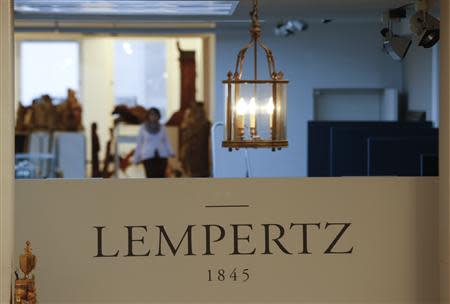 File photo of a lamp hanging over the logo of Cologne auction house Lampertz November 4, 2013, who auctioned a German expressionist painting on behalf of Cornelius Gurlitt. REUTERS/Wolfgang Rattay/Files