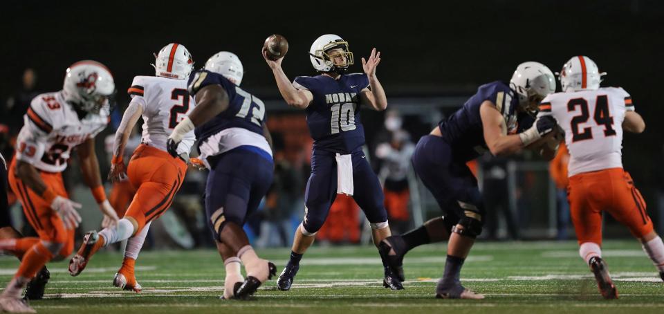 Hoban quarterback Shane Hamm looks to pass during the first half of the Division II state championship game, Friday, Nov. 20, 2020, in Massillon, Ohio. [Jeff Lange/Beacon Journal]