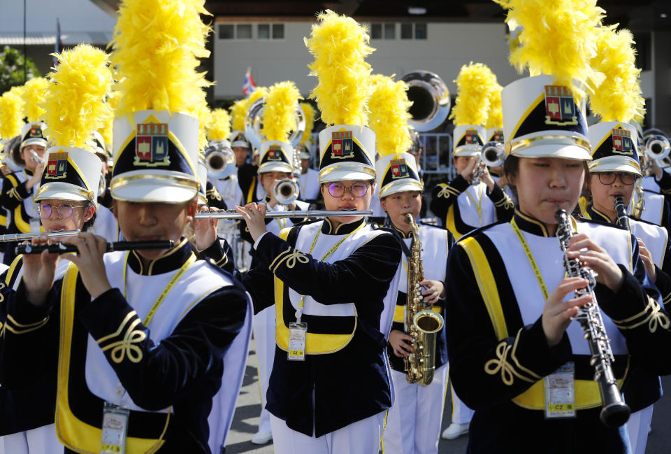 A school band plays before the arrival of Pope Francis at Saint Louis Hospital in Bangkok, Thailand, Thursday, Nov. 21, 2019. Pope Francis called for migrants to be welcomed and for women and children to be protected from exploitation, abuse and enslavement as he began a busy two days of activities in Thailand on Thursday. (AP Photo/Manish Swarup)