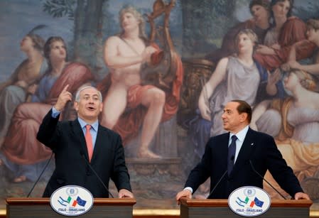 FILE PHOTO: Israel's Prime Minister Netanyahu gestures during a news conference with his Italian counterpart Berlusconi in Rome