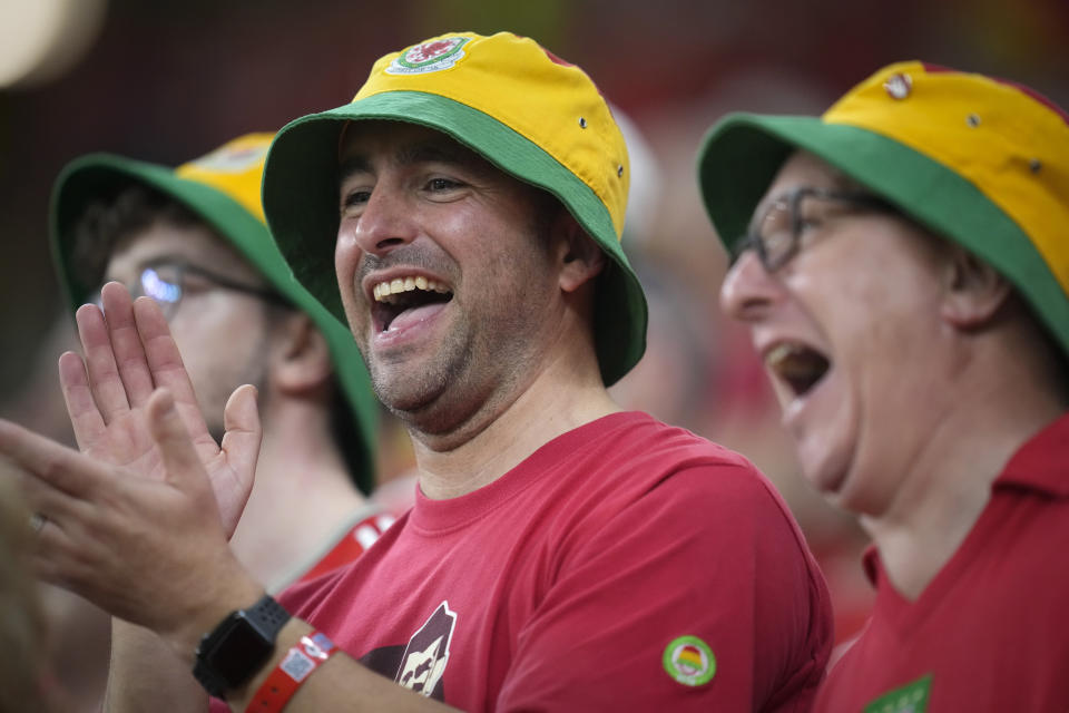Wales fans cheer ahead the World Cup, group B soccer match between the United States and Wales, at the Ahmad Bin Ali Stadium in in Doha, Qatar, Monday, Nov. 21, 2022. (AP Photo/Ashley Landis)