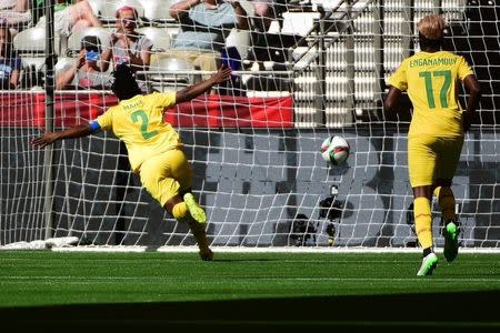 Cameroon defender Christine Manie (2) celebrates in front of forward Gaelle Enganamouit (17) after scoring a goal in the first half against Ecuador in a Group C soccer match in the 2015 women's World Cup at BC Place Stadium. Mandatory Credit: Anne-Marie Sorvin-USA TODAY Sports