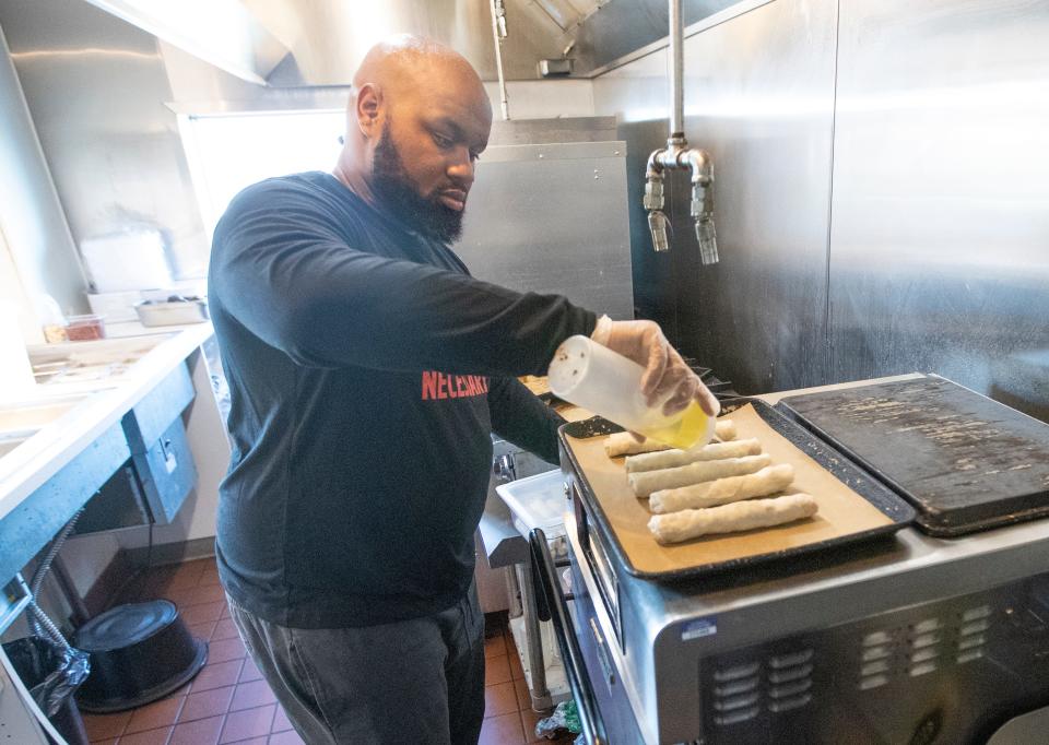 TrueMan McGee prepares Funky Fresh Spring Rolls at his Sherman Phoenix location in Milwaukee. The rolls are baked, not fried, and stuffed with wholesome fillings. McGee began making the rolls for himself when he wanted to eat more healthfully and then for his clients when he was a personal trainer.