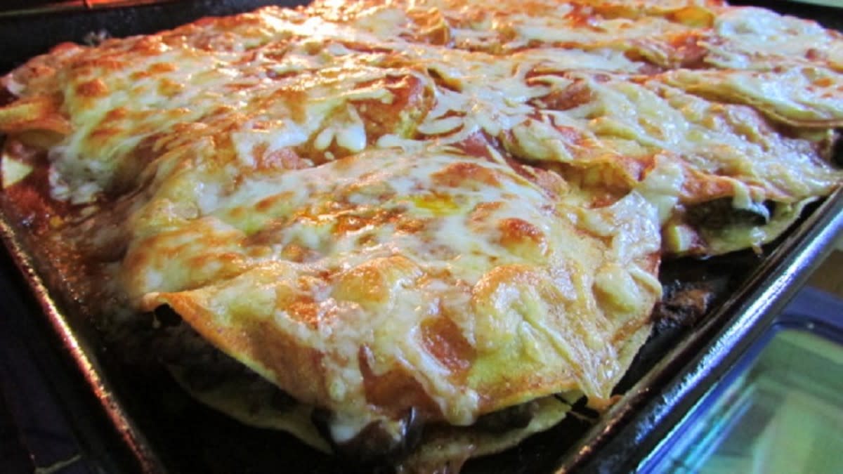 <p>Moore or Less Cooking</p><p>These enchiladas are a cinch to put together, no rolling necessary, no frying tortillas, cuts way back on the calories!</p><p><strong>Get Recipe: </strong><a href="https://mooreorlesscooking.com/beef-enchiladas-stack/" rel="nofollow noopener" target="_blank" data-ylk="slk:Beef Enchilada Stack;elm:context_link;itc:0;sec:content-canvas" class="link rapid-noclick-resp"><strong>Beef Enchilada Stack</strong></a></p>