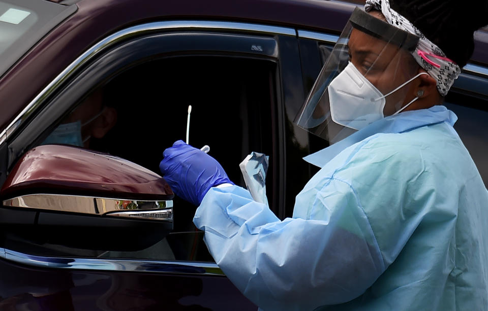 People get free COVID-19 tests without needing to show ID, doctor's note or symptoms at a drive-through and walk up Coronavirus testing center located at Barcroft Community Center in the Arlington, Virginia, zip code with the highest concentration of Coronavirus cases in on May 26, 2020. - From the floor of the New York Stock Exchange to the Church of the Nativity, numerous iconic world landmarks reopened on Tuesday as the global economy eased its way out of lockdown. Two months of shutdowns decreed to slow the spread of the coronavirus pandemic have dealt businesses a devastating blow, particularly in trade, travel and tourism. (Photo by Olivier DOULIERY / AFP) (Photo by OLIVIER DOULIERY/AFP via Getty Images)