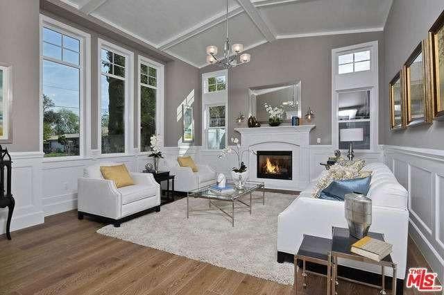 <p>The open-concept home has plenty of space to entertain guests. The living room’s fireplace keeps it nice and cozy. (Realtor.com) </p>