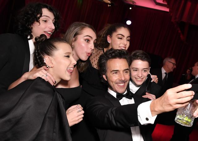 Millie did pose for pics with the group inside the ceremony. Copyright: [Rex]