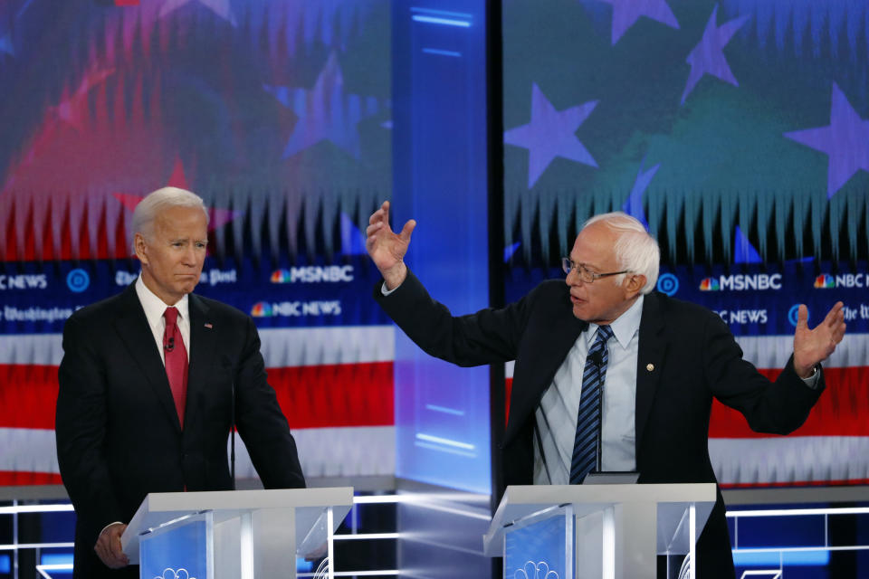 Democratic presidential candidate Sen. Bernie Sanders, I-Vt., speaks as Democratic presidential candidate former Vice President Joe Biden listens during a Democratic presidential primary debate, Wednesday, Nov. 20, 2019, in Atlanta. (AP Photo/John Bazemore)