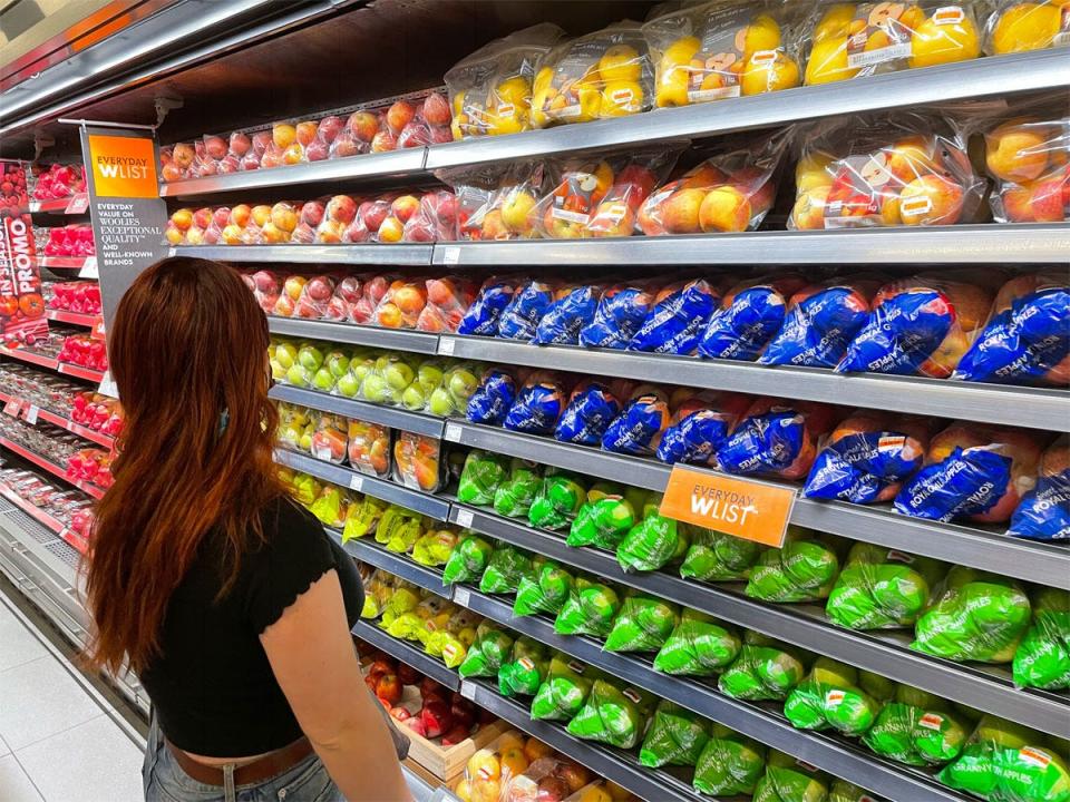 Megan Gieske infront of produce aisle