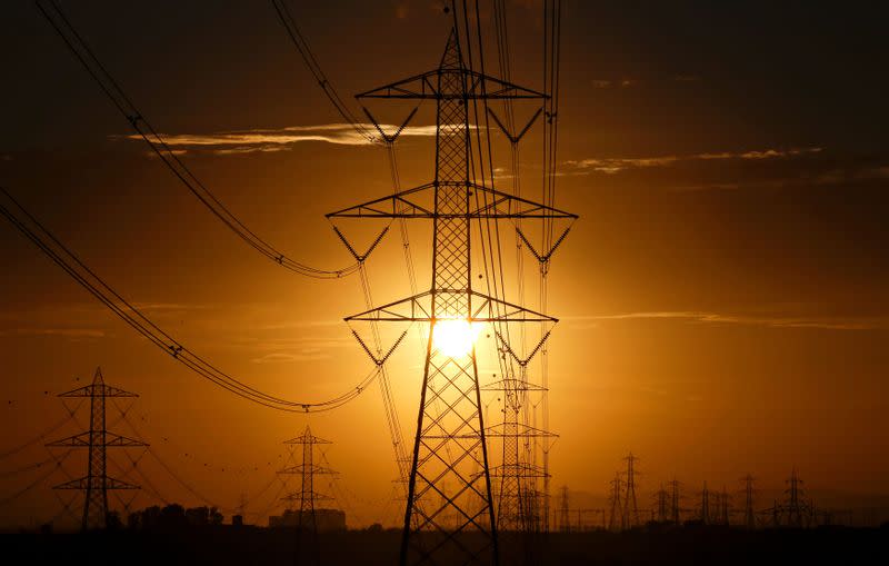 FILE PHOTO: Power lines connecting pylons of high-tension electricity are seen in Montalto Di Castro