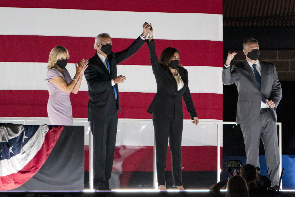 FILE - In this Thursday, Aug. 20, 2020 file photo, Democratic presidential candidate former Vice President Joe Biden and his wife, Jill Biden, and Democratic vice presidential candidate Sen. Kamala Harris, D-Calif., and her husband, Douglas Emhoff, stand together on stage on the fourth day of the Democratic National Convention outside of the Chase Center in Wilmington, Del. Jewish American voters have leaned Democratic for decades, but the GOP is still eyeing modest gains with the constituency in states where President Donald Trump could reap major benefits with even small improvements over his performance in 2016. (AP Photo/Carolyn Kaster)