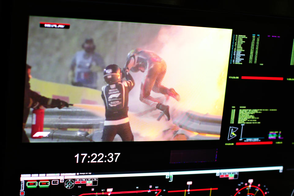 BAHRAIN, BAHRAIN - NOVEMBER 29: Romain Grosjean of France and Haas F1 is pictured on a screen escaping his crash during the F1 Grand Prix of Bahrain at Bahrain International Circuit on November 29, 2020 in Bahrain, Bahrain. (Photo by Peter Fox/Getty Images)