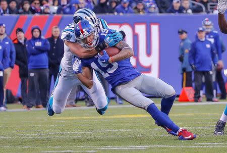 Dec 20, 2015; East Rutherford, NJ, USA; Carolina Panthers free safety Kurt Coleman (20) tackles New York Giants wide receiver Myles White (19) during the third quarter at MetLife Stadium. Mandatory Credit: Jim O'Connor-USA TODAY Sports