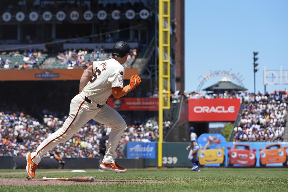 San Francisco Giants' Matt Chapman, left, watches his two-run home run against the Los Angeles Dodgers during the fourth inning of a baseball game Sunday, June 30, 2024, in San Francisco. (AP Photo/Godofredo A. Vásquez)