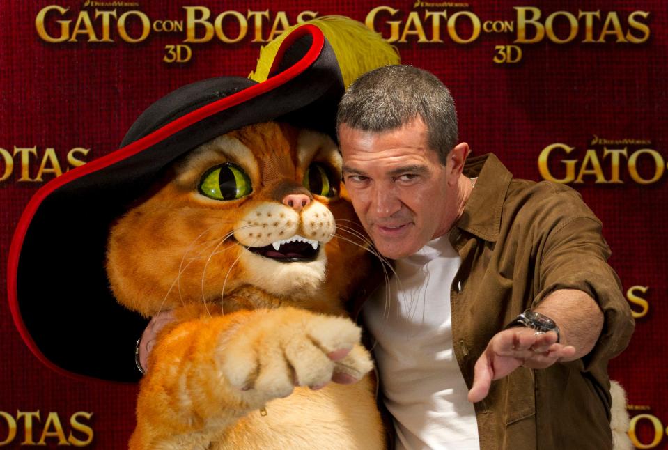 Antonio Banderas, left, with his costumed film character "Puss in Boots" at the animated movie's Mexico City premiere in 2011.