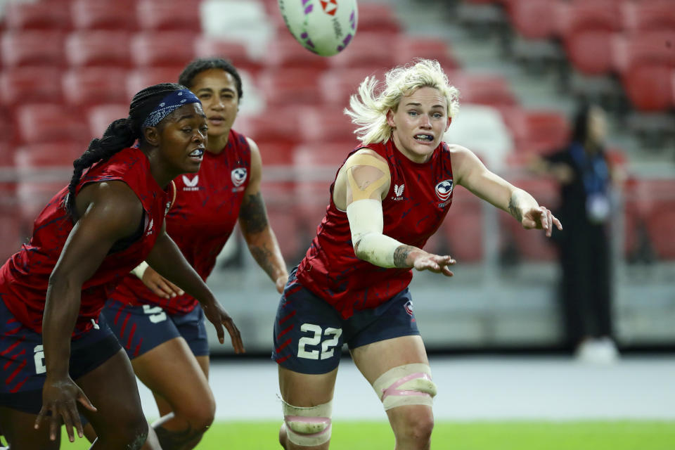 Sammy Sullivan of USA in action during HSBC rugby sevens series in Singapore, on May 4, 2024. The anthem played as Army officer Sammy Sullivan stood to attention and saluted beside her U.S. rugby teammates before a gold-medal game in Hong Kong against Olympic champion New Zealand. No prizes for guessing where her mind may have drifted to: Paris in July. (AP Photo/Suhaimi Abdullah)