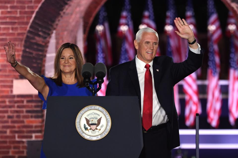 US Vice President Mike Pence (R) arrives with wife Second Lady of the US Karen Pence before speaking during the third night of the Republican National Convention at Fort McHenry National Monument in Baltimore, Maryland, August 26, 2020.