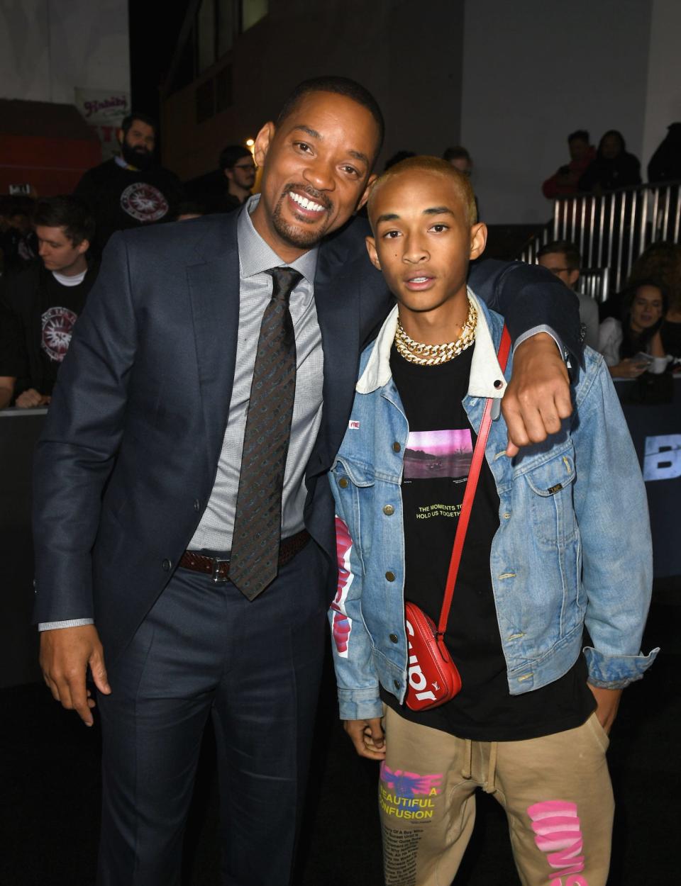 Will Smith and Jaden Smith embrace on a red carpet in December 2017.