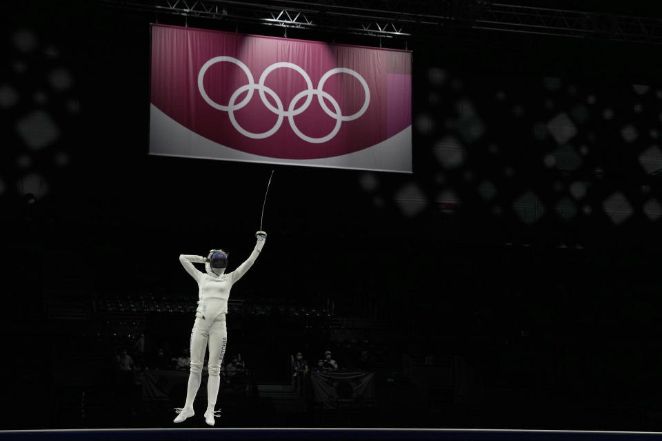 Katrina Lehis of Estonia celebrates winning with her team the gold medal against South Korea in the women's individual Epee team final competition at the 2020 Summer Olympics, Tuesday, July 27, 2021, in Chiba, Japan. (AP Photo/Hassan Ammar)