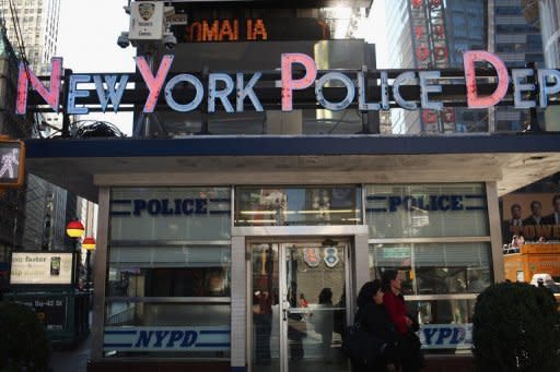 A New York City Police precinct office in Times Square. Sixteen New York Police Department officers pleaded not guilty to charges of widespread fixing of traffic tickets as well as more serious crimes, in the second scandal to hit the force in a week