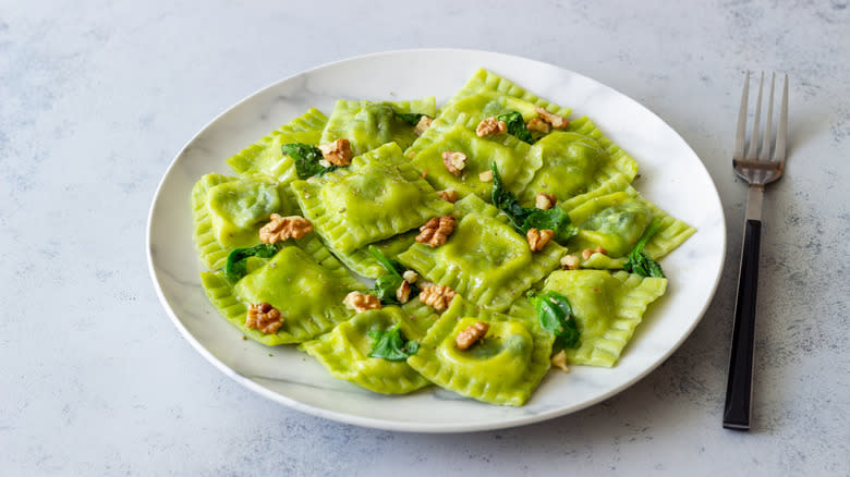 Green ravioli on plate