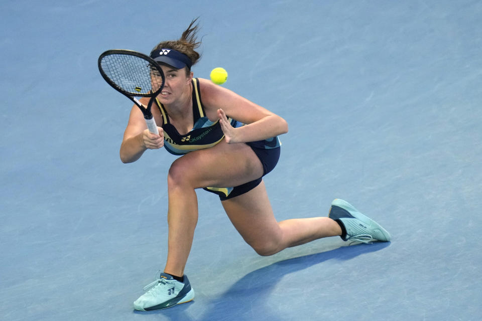 Linda Noskova of the Czech Republic plays a forehand return to Iga Swiatek of Poland during their third round match at the Australian Open tennis championships at Melbourne Park, Melbourne, Australia, Saturday, Jan. 20, 2024. (AP Photo/Andy Wong)