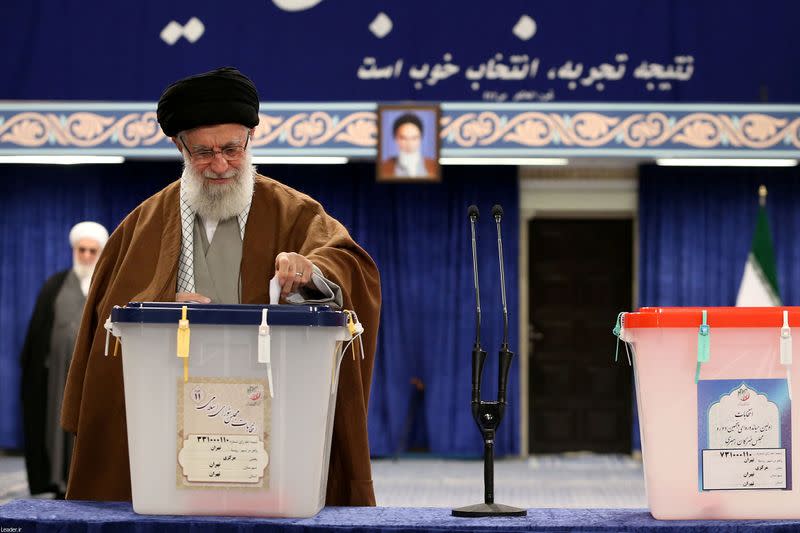 Iran's Supreme Leader Ayatollah Ali Khamenei casts his vote at a polling station during parliamentary elections in Tehran