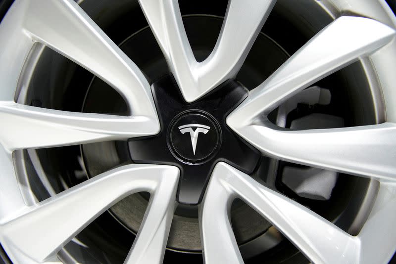 FILE PHOTO: Tesla logo is seen on a wheel rim during the media day for the Shanghai auto show in Shanghai