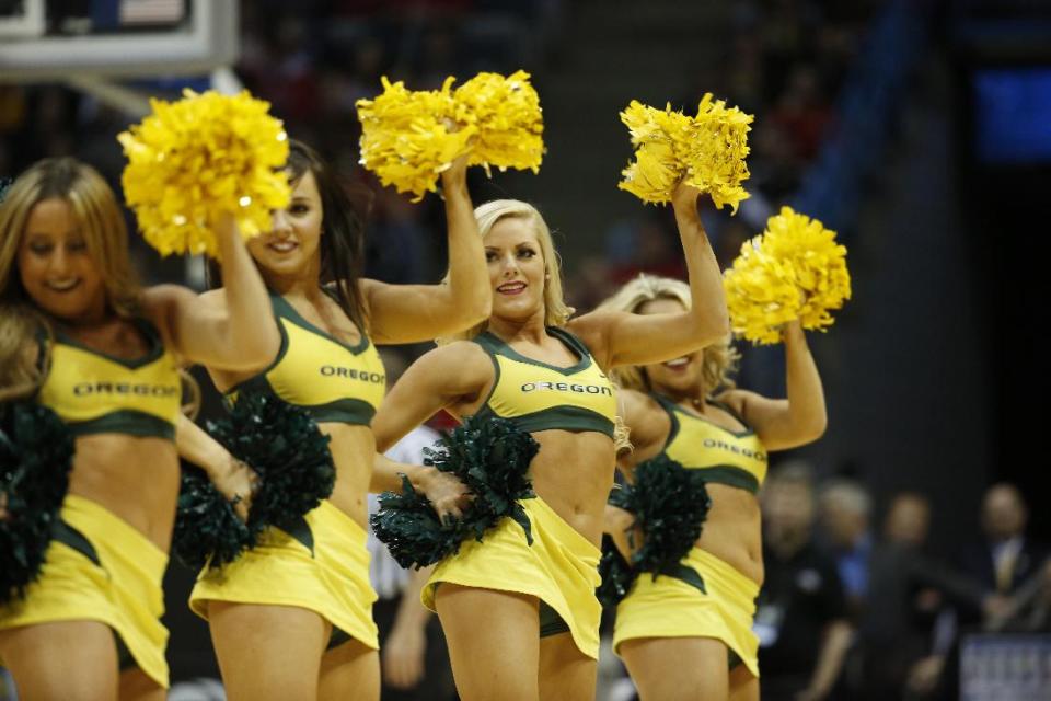 Oregon cheerleaders perform during the second half of a second-round game against the BYU in the NCAA college basketball tournament Thursday, March 20, 2014, in Milwaukee. (AP Photo/Jeffrey Phelps)